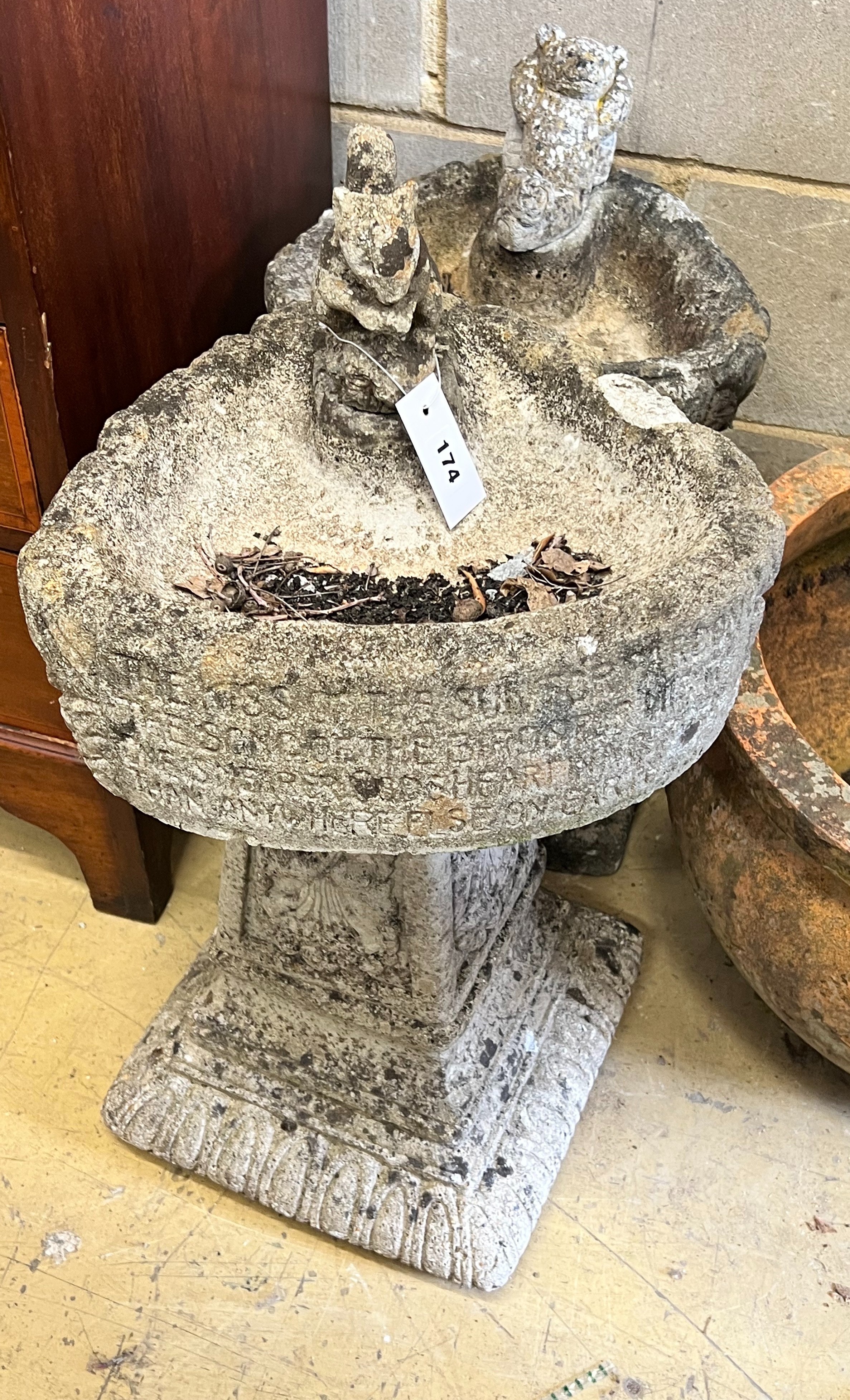 Two reconstituted stone garden bird baths, tallest 66cm